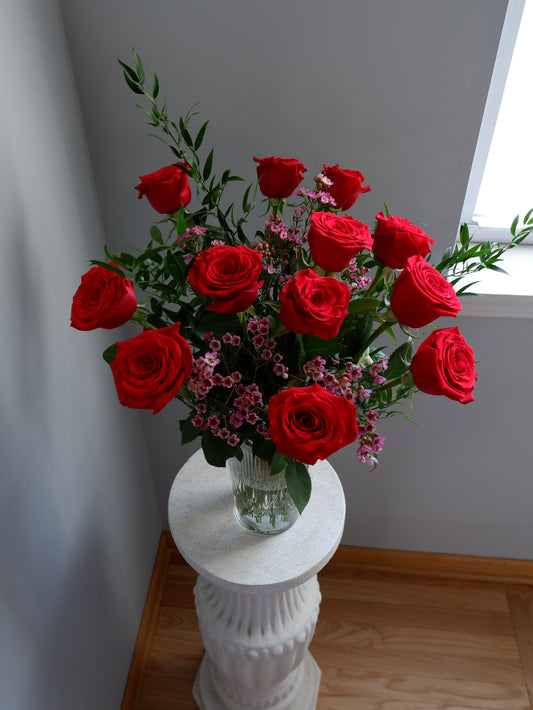 Dozen roses in a vase