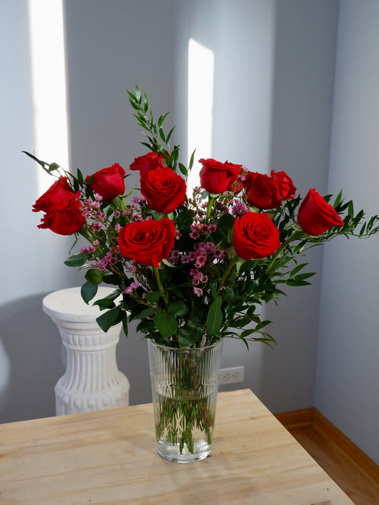Dozen roses in a vase